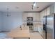 Modern kitchen featuring stainless steel appliances, light cabinetry, and a spacious countertop island at 9620 Doris Ln, Orlando, FL 32829