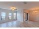 Spacious living room with ample natural light from large windows and a sliding glass door at 9620 Doris Ln, Orlando, FL 32829
