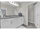 Clean bathroom featuring a granite countertop, dual sinks, and a separate toilet room at 10316 Spring Arbor Ln, Winter Garden, FL 34787