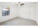 Bedroom with neutral carpeting, a ceiling fan, and a large window at 1042 Catfish Creek Ct, Oviedo, FL 32765