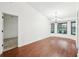 Bright dining room features hardwood floors, chandelier, and bay windows at 1042 Catfish Creek Ct, Oviedo, FL 32765