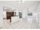 Large, open living space connects the kitchen and dining areas with tiled floors at 1042 Catfish Creek Ct, Oviedo, FL 32765