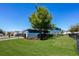 Well-manicured backyard with lush lawn and mature landscaping creates a serene outdoor space at 11880 Sonnet Ave, Orlando, FL 32832