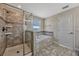 Luxurious bathroom featuring a separate shower and soaking tub with tile surround at 11880 Sonnet Ave, Orlando, FL 32832