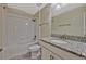 Bright bathroom featuring a shower-tub combo, granite countertops and modern fixtures at 11880 Sonnet Ave, Orlando, FL 32832