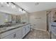 Beautiful bathroom with double vanities, granite countertops, and tiled shower at 11880 Sonnet Ave, Orlando, FL 32832