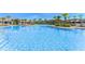 Large community pool with beach entry, sun loungers, and splash pad for Gathering fun at 11880 Sonnet Ave, Orlando, FL 32832