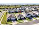 Aerial shot of a charming single-Gathering home with a well-manicured lawn and beautiful neighborhood setting at 1232 Celery Oaks Ln, Sanford, FL 32771