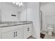 Bathroom featuring double sinks with granite countertops, and a glass-enclosed shower at 1232 Celery Oaks Ln, Sanford, FL 32771