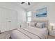 Neutral bedroom with double door closet, modern lighting and carpet flooring at 1232 Celery Oaks Ln, Sanford, FL 32771