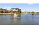 Scenic view of a community pond with a fountain and lush landscaping at 1232 Celery Oaks Ln, Sanford, FL 32771