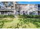 Back of the property showing the screened patios, lush green lawn and manicured shrubbery at 139 Durham Pl, Longwood, FL 32779