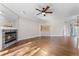 Bright living room with hardwood floors, modern lighting, and a cozy fireplace at 139 Durham Pl, Longwood, FL 32779