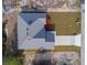 Birds eye view of a single-Gathering home with a grey roof and long driveway at 1447 Kissimmee Way, Kissimmee, FL 34759