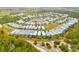 Aerial view of the property indicated by a red arrow and the surrounding neighborhood at 1468 Fairview Cir, Reunion, FL 34747