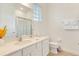 Bright bathroom with quartz countertops, shower and white cabinets at 1468 Fairview Cir, Reunion, FL 34747