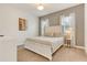 Elegant bedroom featuring a tufted headboard, neutral tones, and natural light at 1468 Fairview Cir, Reunion, FL 34747