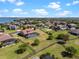 Aerial view of a home with a screened-in pool and large fenced yard in a scenic neighborhood at 14823 Borromini St, Montverde, FL 34756