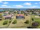 Aerial view of a home with a screened-in pool and a large fenced yard with lake views at 14823 Borromini St, Montverde, FL 34756