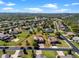 Aerial view of a two-story home with spacious lot outlined in red in a residential area with green spaces at 14823 Borromini St, Montverde, FL 34756