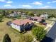 Aerial view of a two-story home with well-maintained landscaping and a spacious fenced yard in a neighborhood at 14823 Borromini St, Montverde, FL 34756