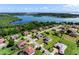 Expansive aerial view of a lakeside residential community with manicured lawns and beautiful waterfront homes at 14823 Borromini St, Montverde, FL 34756