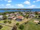 Aerial view of a home with a screened-in pool and spacious fenced yard near a lake community at 14823 Borromini St, Montverde, FL 34756