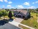 Aerial view of a two-story home with a three-car garage and a basketball hoop in the driveway at 14823 Borromini St, Montverde, FL 34756