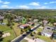 Aerial view of a home with a pool in a Gathering-friendly neighborhood with lush greenery and sidewalks at 14823 Borromini St, Montverde, FL 34756