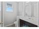 Modern bathroom with a sleek vanity, a white sink, and a mirror creating a clean and functional space at 14823 Borromini St, Montverde, FL 34756