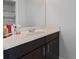 Bathroom featuring a modern vanity with a white sink, sleek faucet, and dark cabinets for a modern look at 14823 Borromini St, Montverde, FL 34756