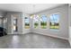 Dining area with large windows overlooking the pool and backyard, providing a seamless indoor-outdoor living experience at 14823 Borromini St, Montverde, FL 34756