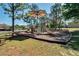 Well-equipped community playground featuring a slide, climbing structures, and shaded picnic area at 14823 Borromini St, Montverde, FL 34756