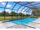 Relaxing screened-in pool and spa with brick pavers, perfect for enjoying sunny days in a private oasis at 14823 Borromini St, Montverde, FL 34756