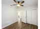 Spacious bedroom with fan, closet, and doorway at 1503 Holly Rd, Lakeland, FL 33801