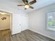 Bright bedroom showcasing window, closet, and doorway at 1503 Holly Rd, Lakeland, FL 33801