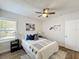 Comfortable bedroom with modern decor, fan, and natural light at 1503 Holly Rd, Lakeland, FL 33801