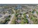 Aerial view of neighborhood with mature trees and easy access to local lake and community amenities at 155 Aunt Polly Ct, Orlando, FL 32828