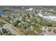 An aerial view shows the home's proximity to community amenities, shopping, and local roadways at 155 Aunt Polly Ct, Orlando, FL 32828