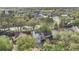 Aerial view of the property showcasing its location and the surrounding neighborhood with mature trees at 155 Aunt Polly Ct, Orlando, FL 32828