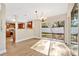 Open concept dining area with hardwood floors, a sliding glass door, and views of the backyard at 155 Aunt Polly Ct, Orlando, FL 32828