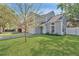 Inviting two-story home with a well-kept lawn and a neutral-toned exterior at 155 Aunt Polly Ct, Orlando, FL 32828