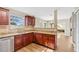 Bright and modern kitchen featuring granite countertops and rich wood cabinetry at 155 Aunt Polly Ct, Orlando, FL 32828