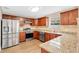 Modern kitchen featuring stainless steel appliances, granite countertops, and ample cabinet space at 155 Aunt Polly Ct, Orlando, FL 32828