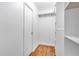 This walk-in closet offers ample storage space with built-in shelving and a clean, minimalist design at 155 Aunt Polly Ct, Orlando, FL 32828