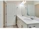 Well-lit bathroom with double sinks, modern fixtures, and a spacious feel at 15837 Sweet Lemon Way, Winter Garden, FL 34787