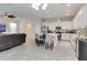 Modern, open-concept kitchen with white cabinetry, stainless appliances, and a center island at 15837 Sweet Lemon Way, Winter Garden, FL 34787