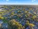 An aerial view captures a sprawling neighborhood with lush tree coverage and classic residential charm at 1756 Waterbeach Ct, Apopka, FL 32703