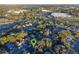 Aerial view of the neighborhood showcases the location, nearby shopping, and a picturesque landscape at 1756 Waterbeach Ct, Apopka, FL 32703