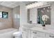 Elegant bathroom showcasing a white vanity, modern fixtures, and a separate tub at 1756 Waterbeach Ct, Apopka, FL 32703